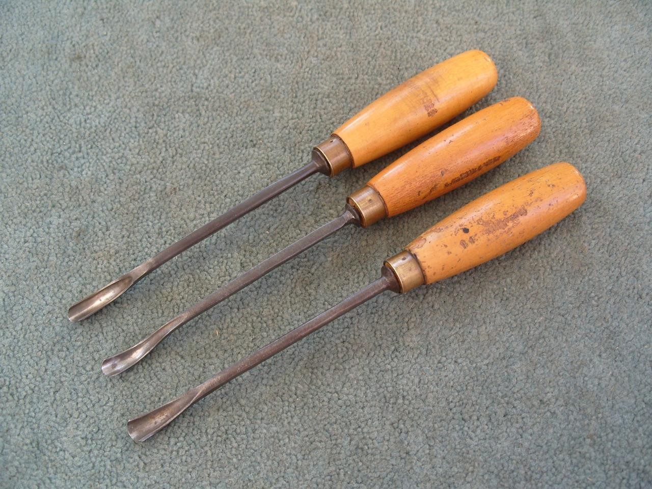 Three spoon bent Carving gouges by S J Addis, J B Addis, and W Marples.