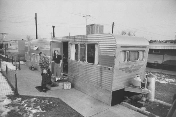 Young couple and family living in trailer Historic Old Photo