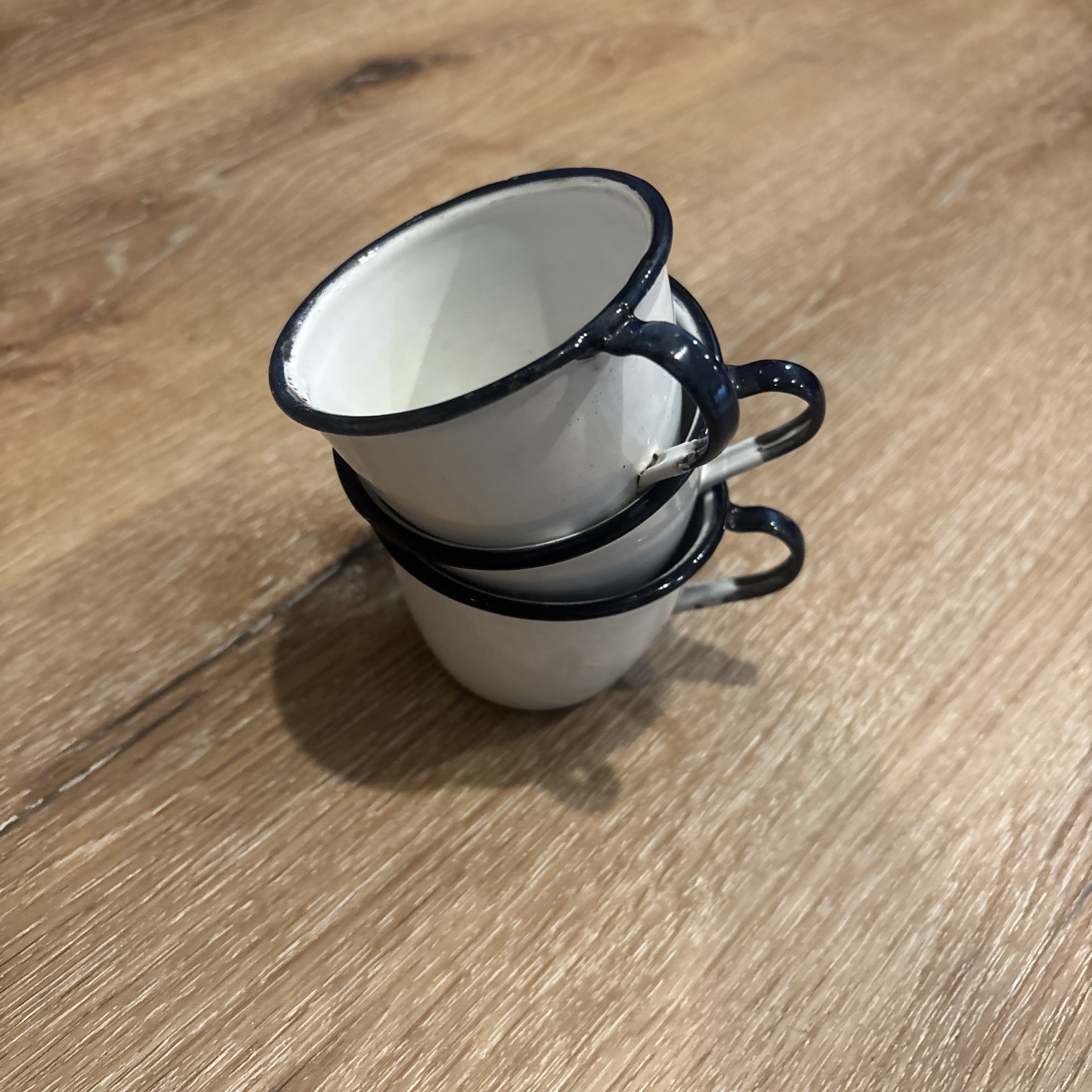 3 PC VINTAGE BLACK AND WHITE ENAMELWARE  3 Cups. VGC  3 75” W Handles