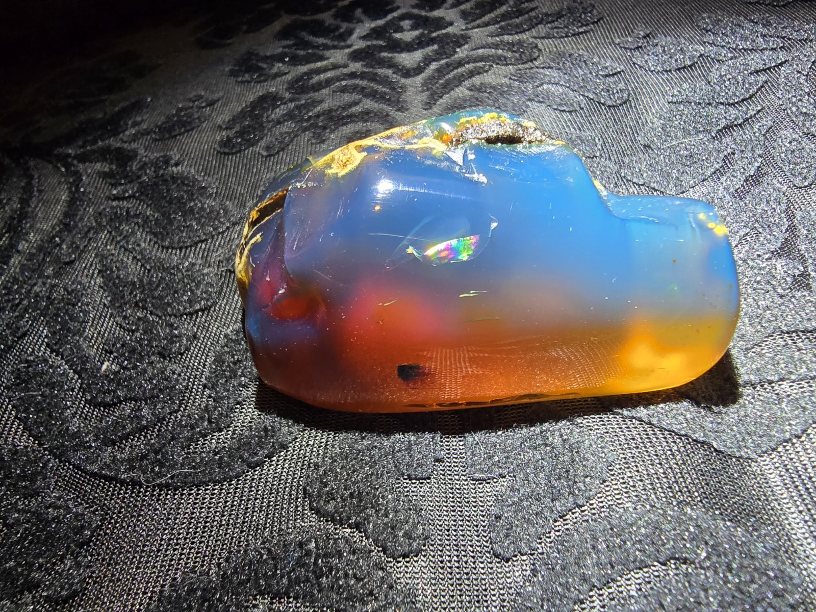 39g AAA+ Indonesian Blue Amber Polished Specimen - Internal Rainbow Glow