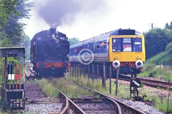 Colour railway photograph of a DMU and 7715 at Quainton Road on 14/06/1986