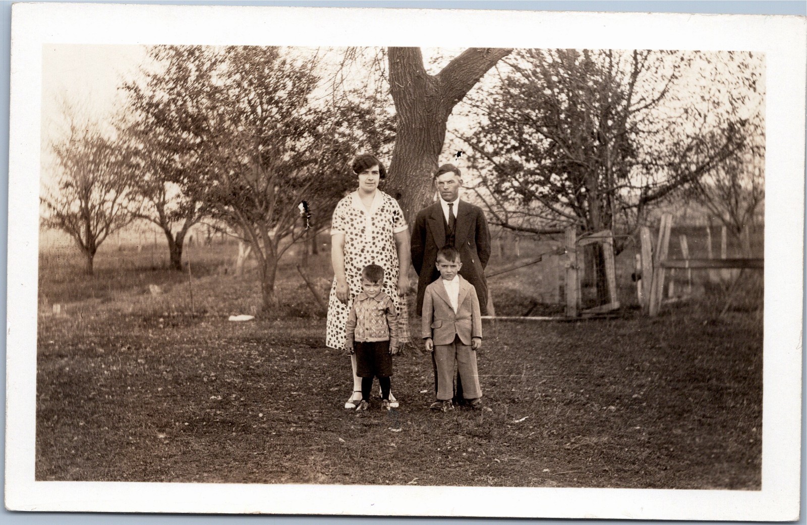 RPPC: Family in yard circa 1926-1940s
