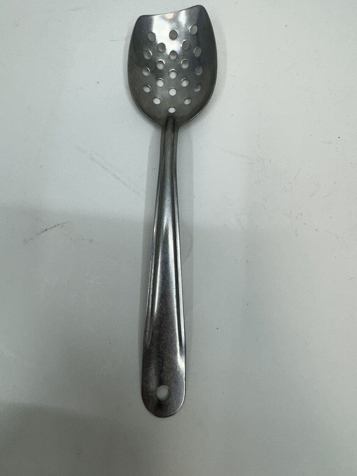 vintage metal stainless serving spoon angled slotted