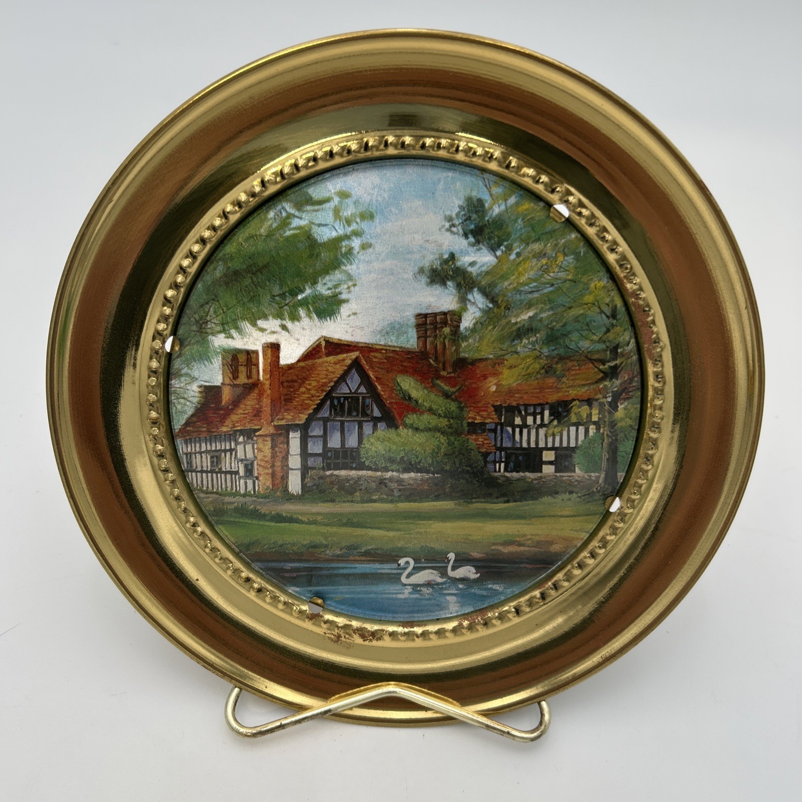 vintage brass-framed foil art of an English country cottage. New Old Stock