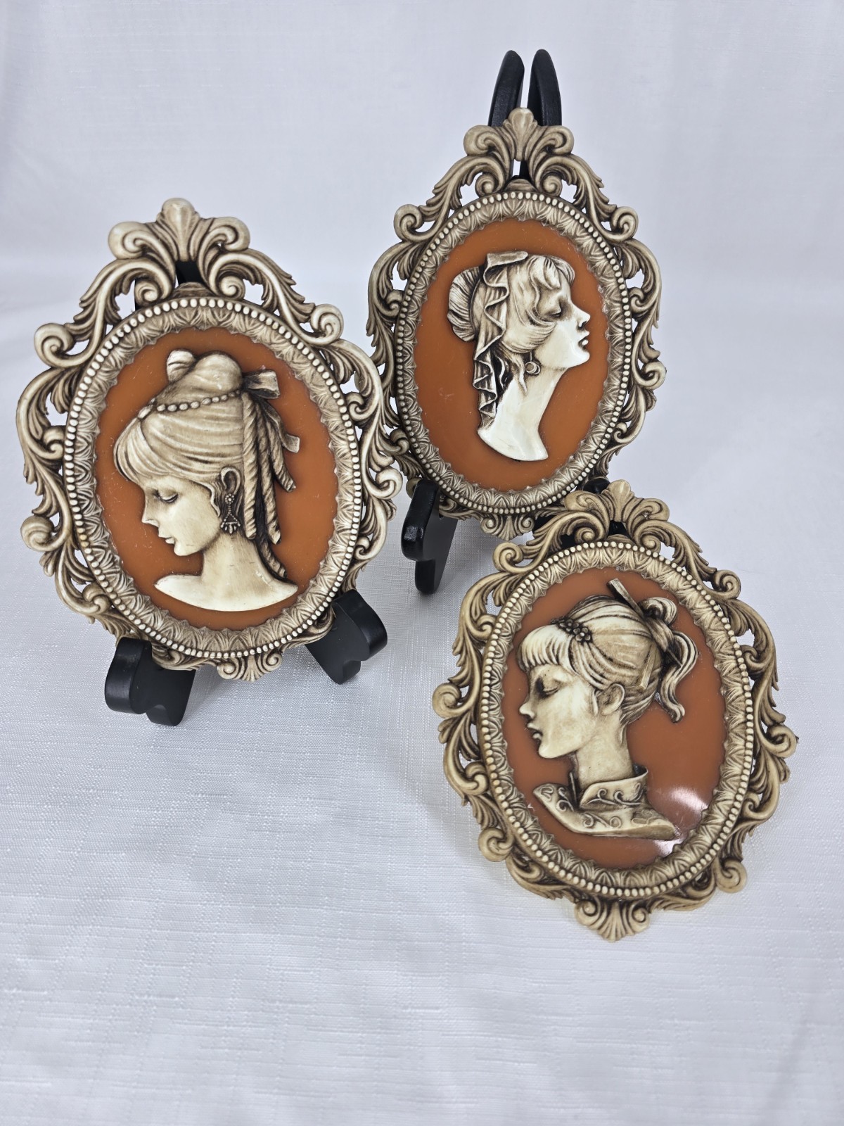 3 VIntage Victorian-style cameo wall plaques featuring Molded Profiles Of Women. 3 VIntage Victorian-style cameo wall plaques featuring Molded Profiles Of Women.