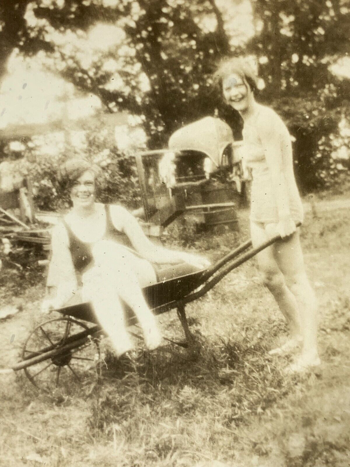 (AmJ) FOUND Photo Photograph Vintage Glowing Girls Wheelbarrow Exposure Odd