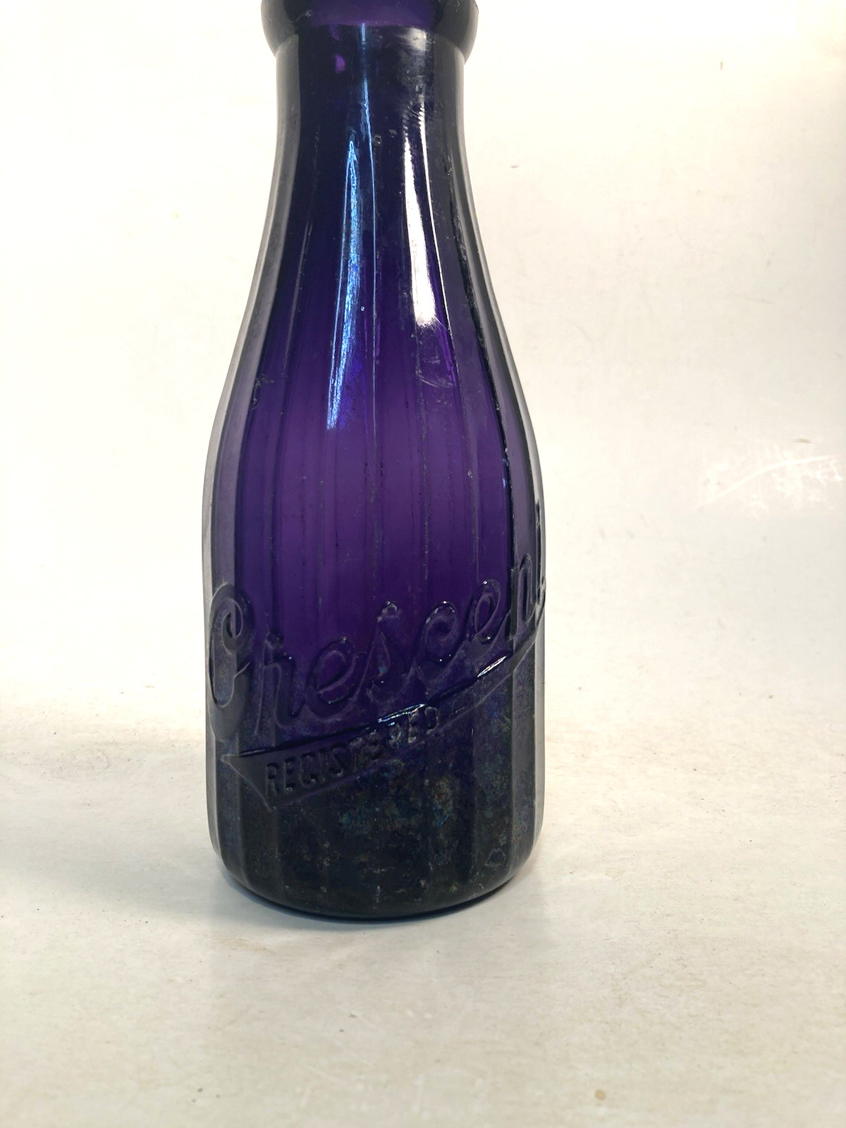 Milk bottle, round QUART, CRESCENT Dairy, irradiated, DUG bottle