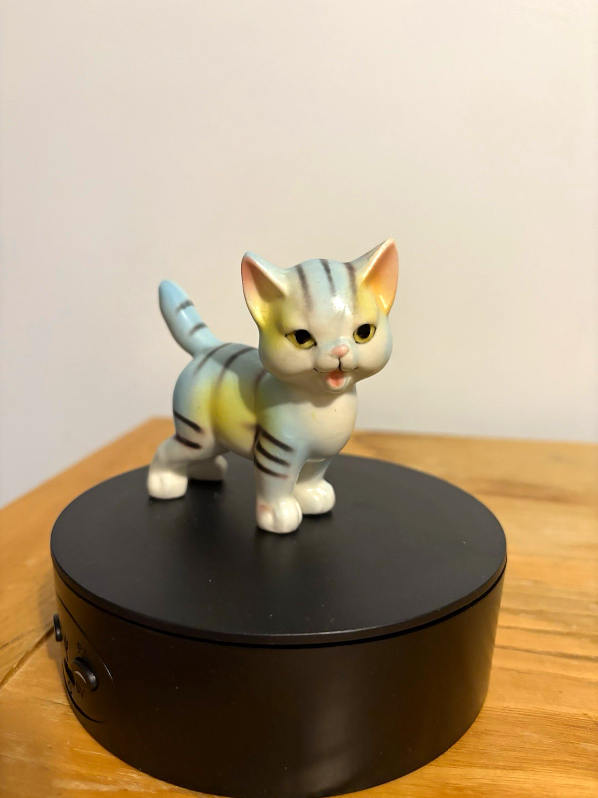 This is a vintage mid-20th-century Japanese ceramic striped kitten figurine.