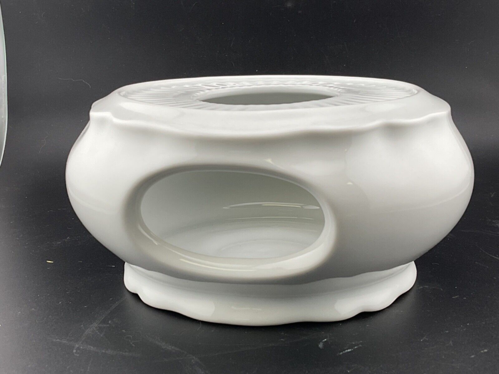 white porcelain teapot warmer