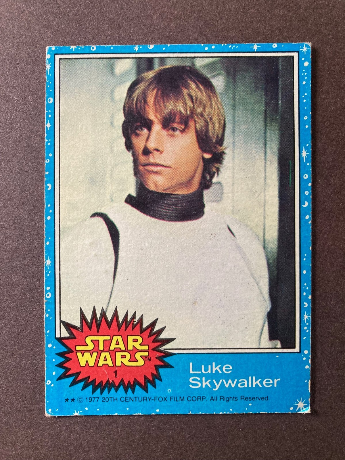 1977 Topps Star Wars Luke Skywalker #1, Series 1, Blue, RC, low-grade, creases
