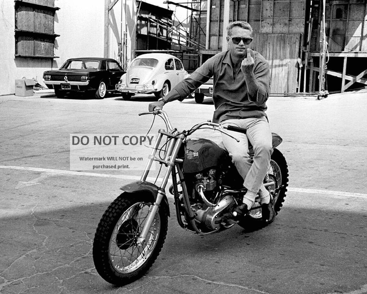 STEVE McQUEEN ON MOTORCYCLE MAKING FEELINGS KNOWN - 8X10 PUBLICITY PHOTO (AB890)