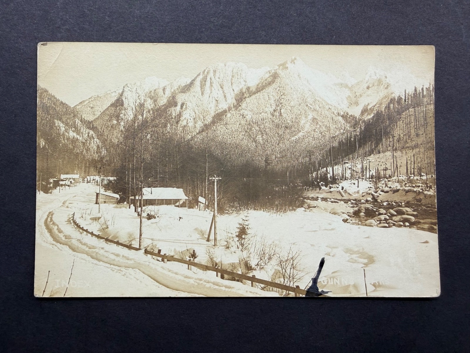 RPPC Gunn’s Peaks in Winter Snow with buildings, road, and electric poles