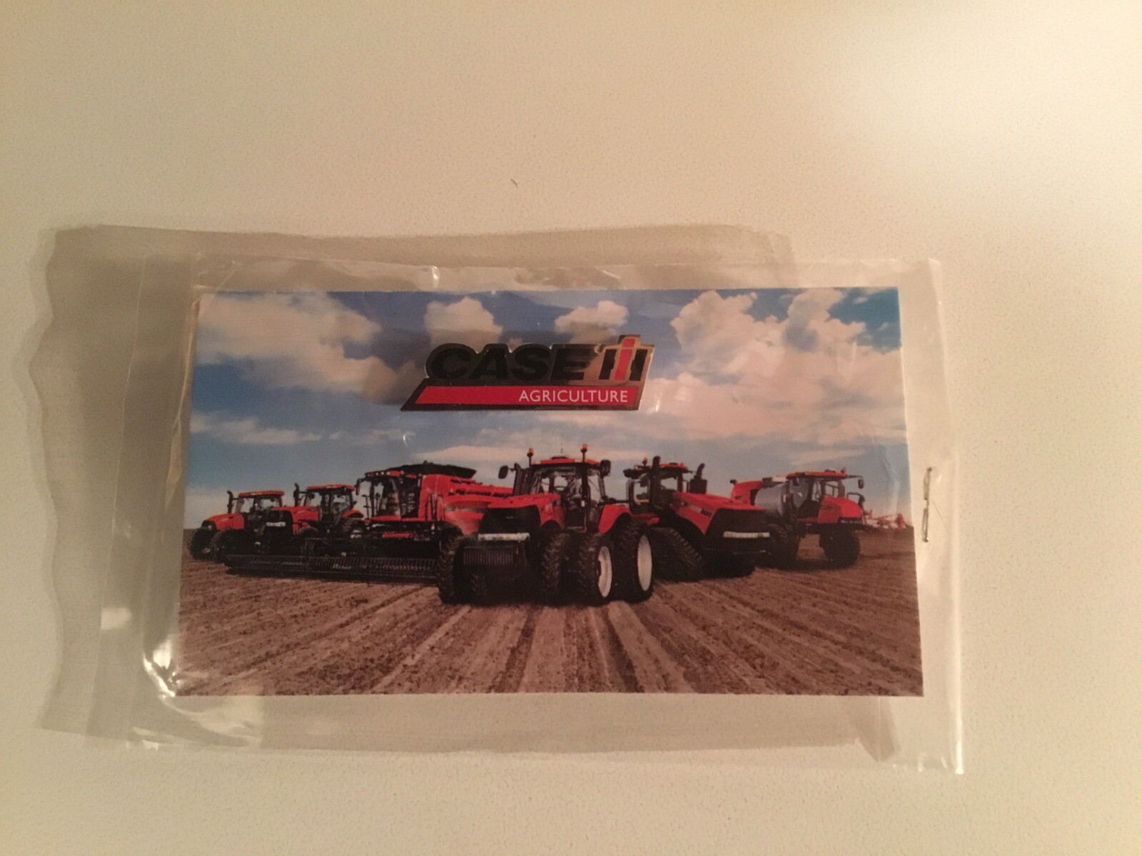 Case IH Logo Souvenir Metal Hat / Lapel Pin on Card Sealed New