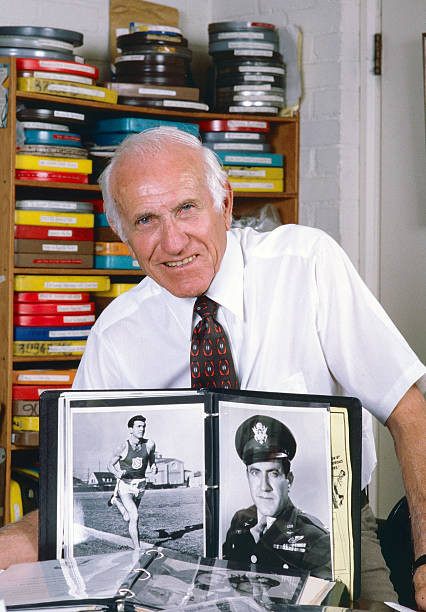 American former bombardier Lt Louis Zamperini as he poses at home - Old Photo 5
