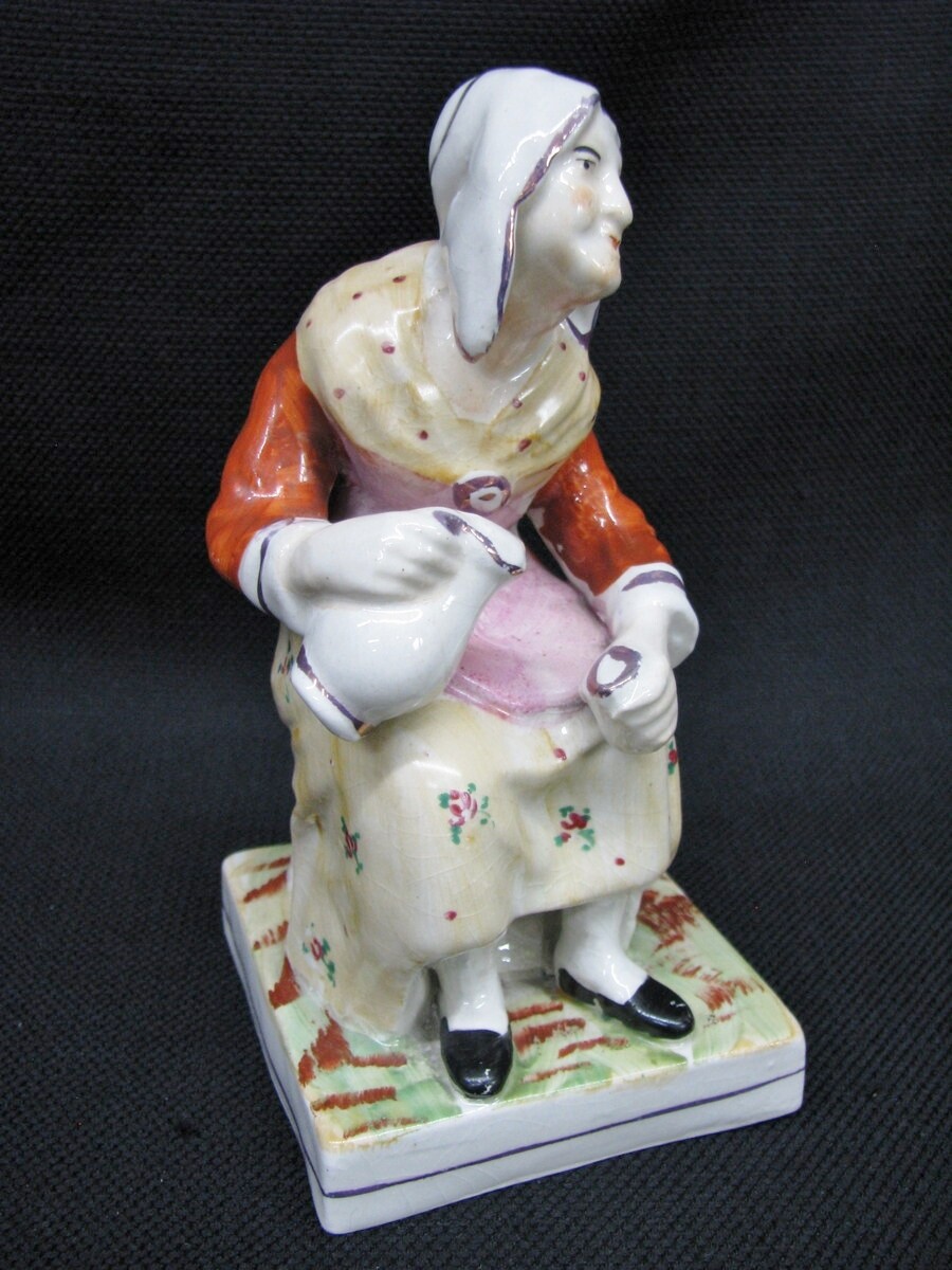 Antique Staffordshire Handpainted Seated Woman Pouring From A Pitcher; 1860\'s