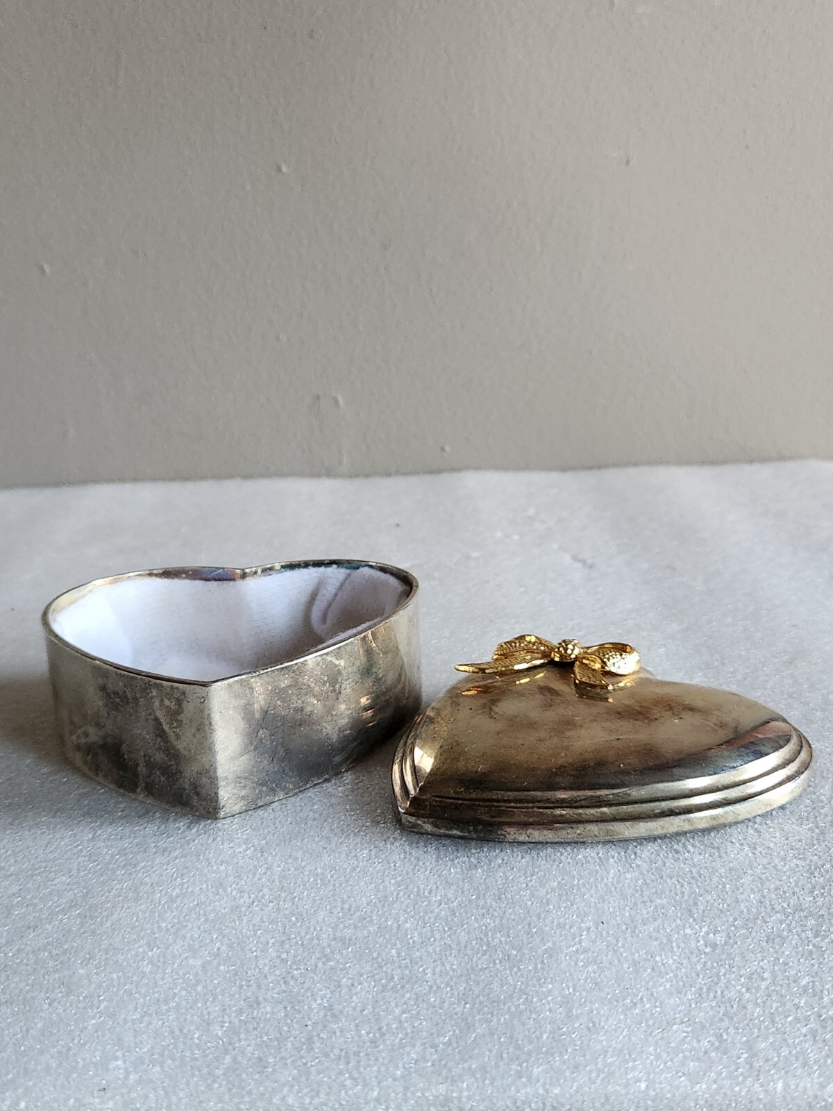 Vintage Heart-Shaped Silver-Tone Jewelry or Trinket Box with Gold Bow on Lid