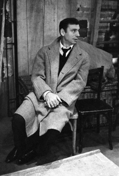 Yves Montand settling the details of his upcoming recital at the T- Old Photo 4