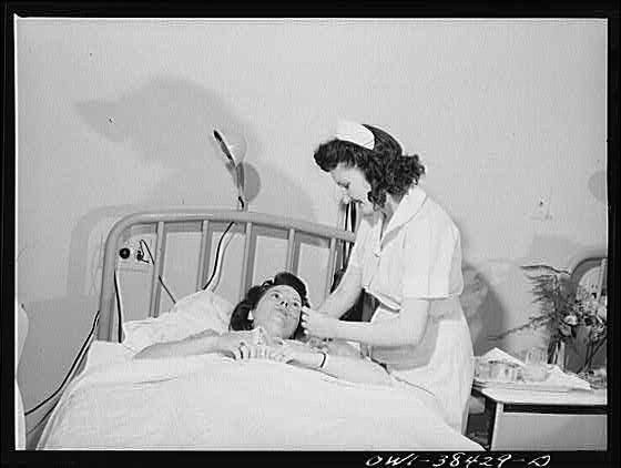 Photo:Washington D.C. 1940s Nurse Student at Bedside in Hospital Room
