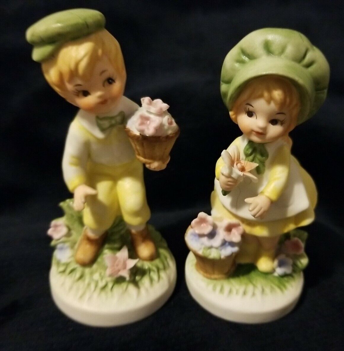 Capodimonte Porcelain Figurines Of Boy holding basket  and Girl holding flower. 