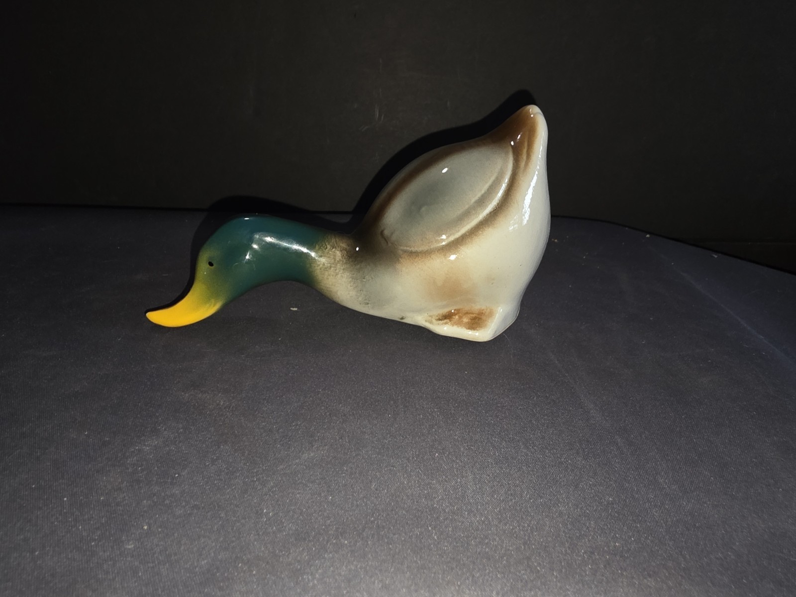 vintage ceramic or porcelain mallard duck figurine depicted  \