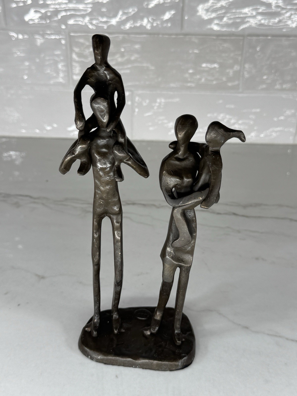 Danya B. Parents Carrying Children Bronze Sculpture