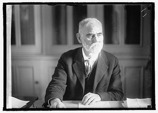 Photo:Jas R Mann Portrait ca 1921 Elderly Man Desk Beard Suit