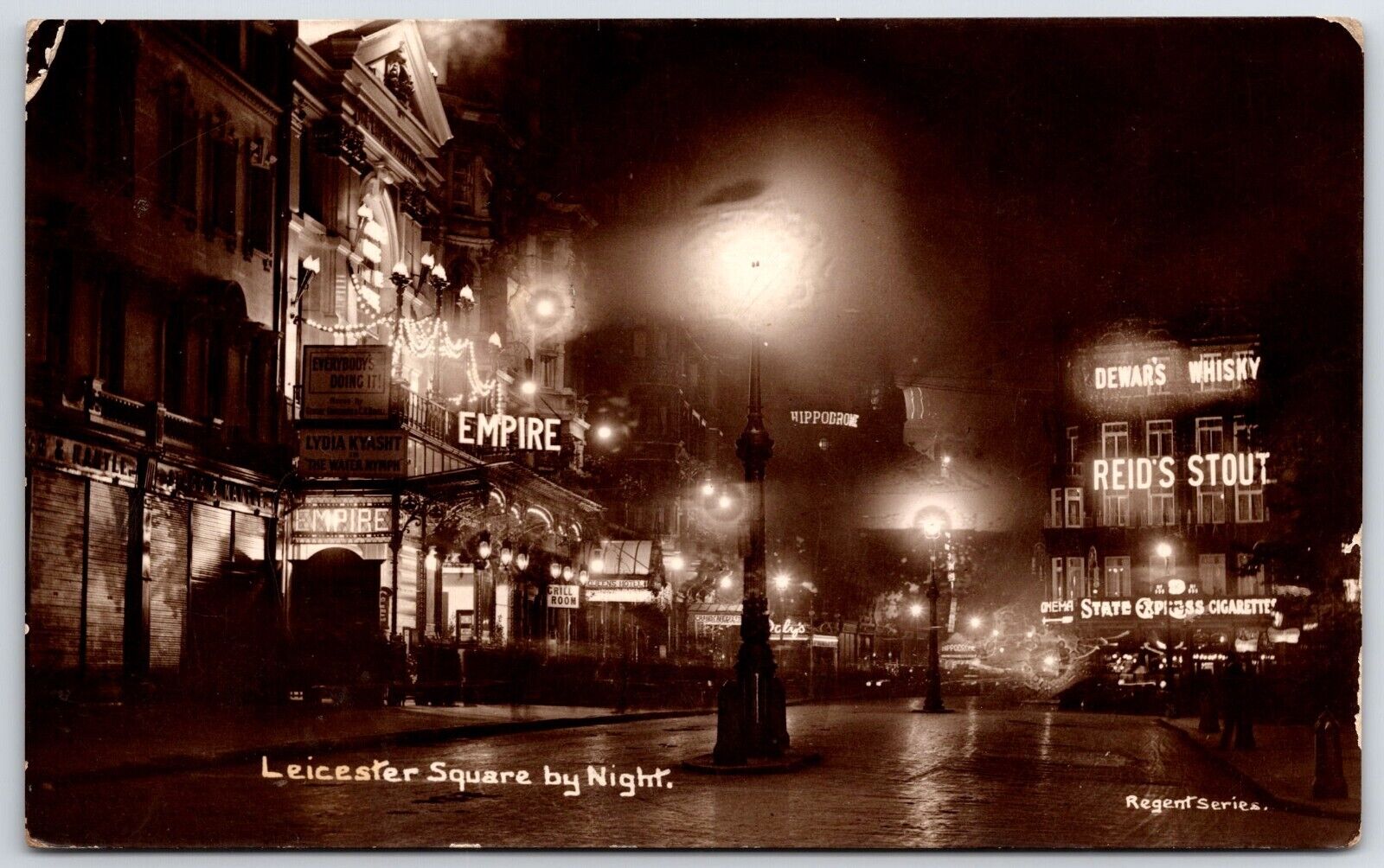 Leicester Square at Night Reid's Stout EMPIRE THEATRE CINEMA MUSIC HALL RPPC