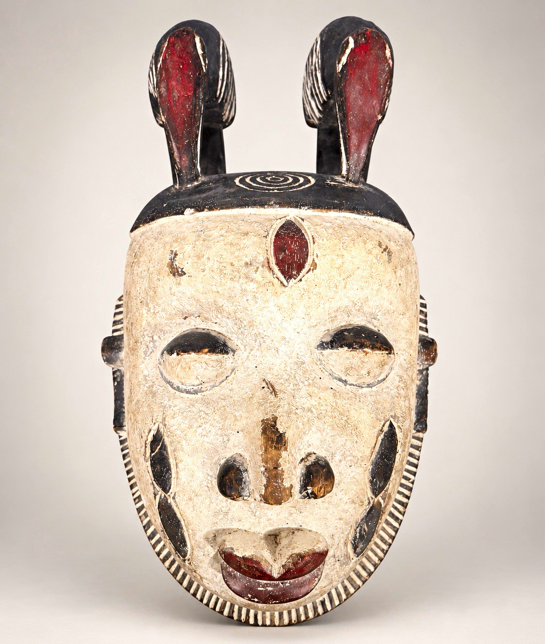 Hand-Carved African Mask, Painted Wood Face, Twin Crests with Raised Figures
