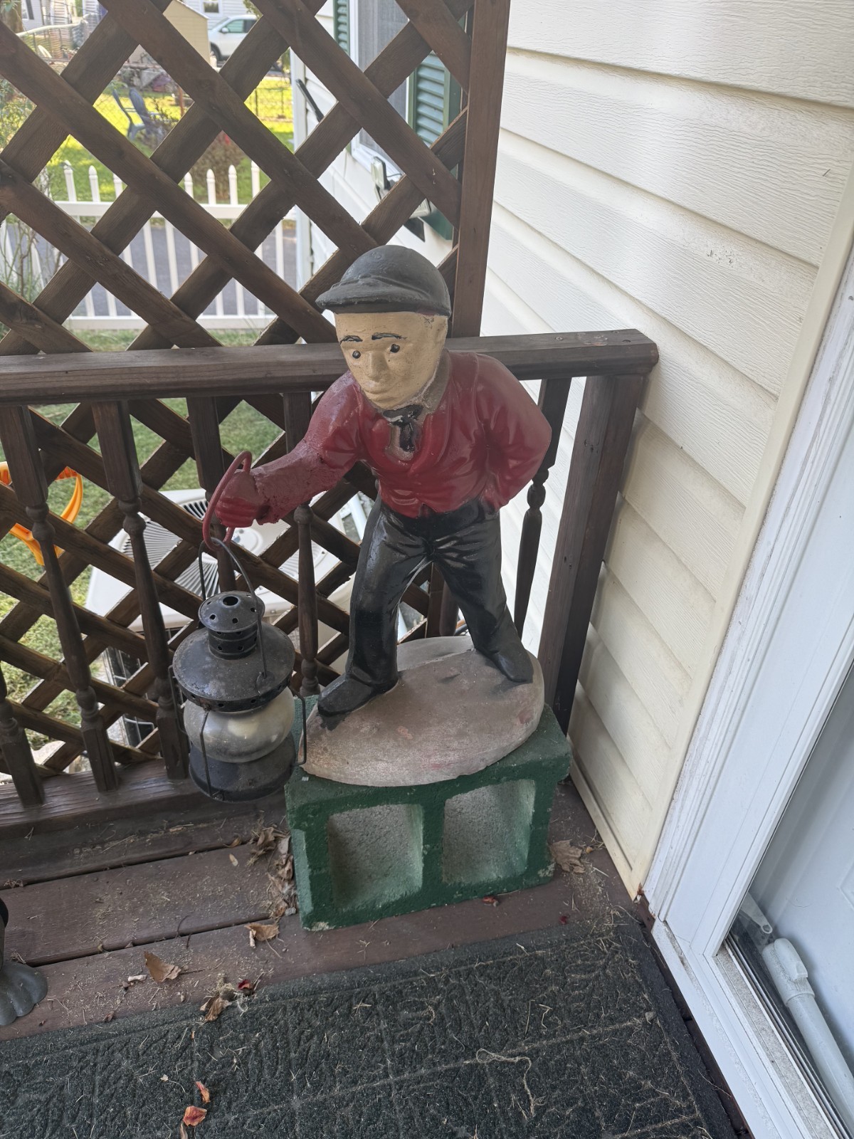 Antique American statue with lantern.