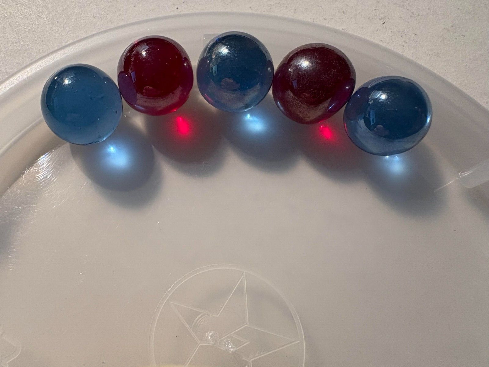 6 Vintage Antique Marbles 3 Solid Blue; 2 Solid Red; 1 Partial Red, + 1 Steelie