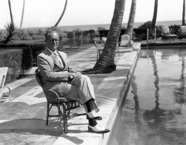 Ambassador Joseph P Kennedy sitting by a swimming pool a suit at h- Old Photo