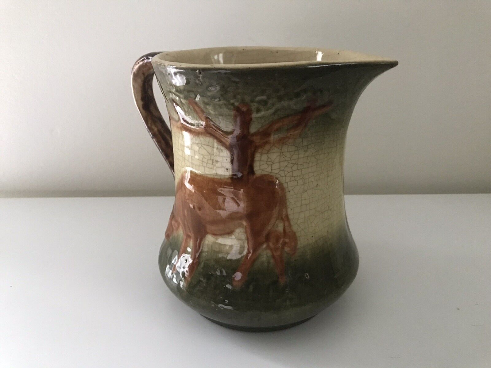 Antique Roseville Pottery 7.5” Milk pitcher w/Brown Cow. EUC