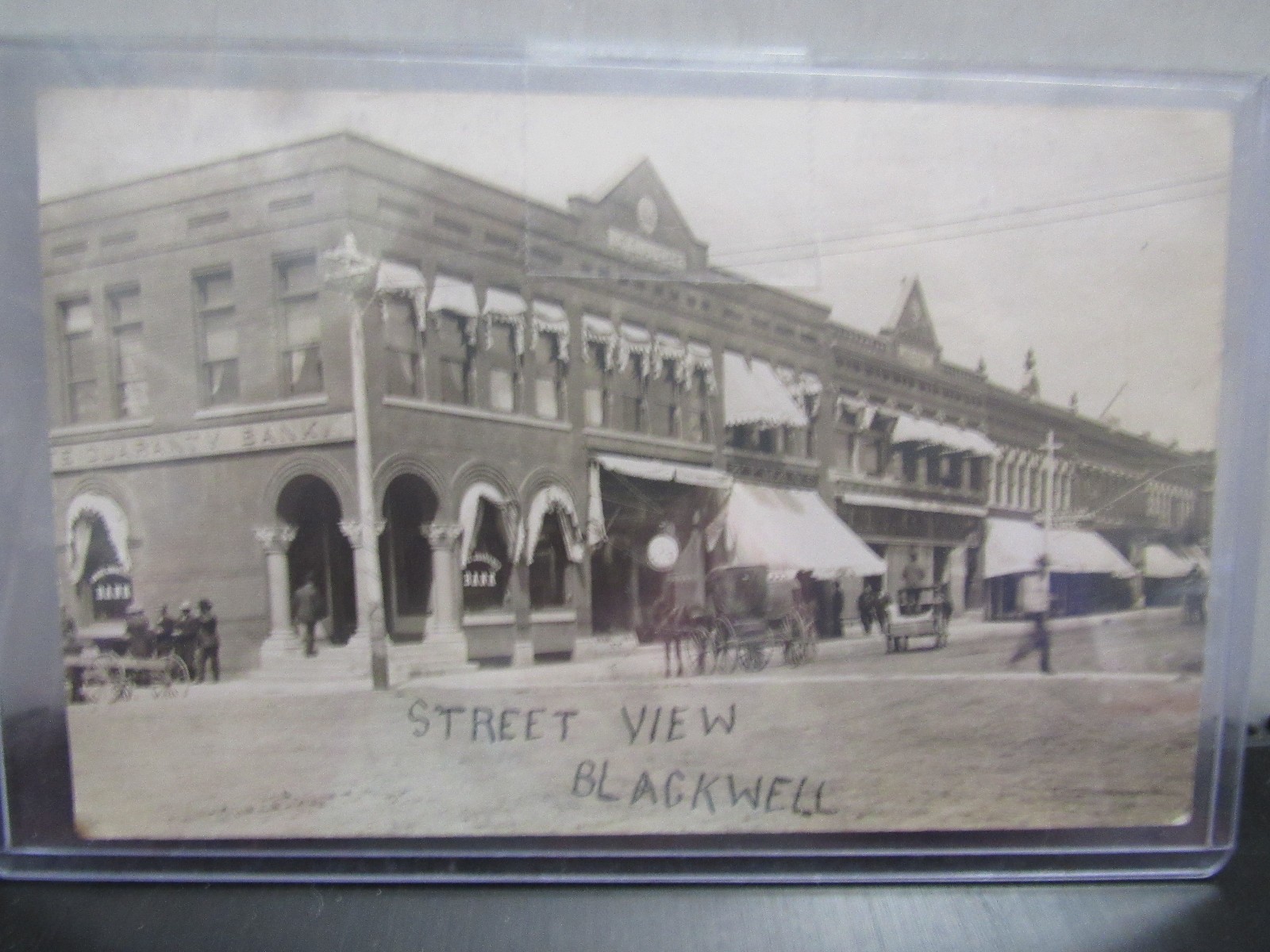 RPPC Real Photo Postcard Blackwell ,Oklahoma Street view Bank  Horses Wagons
