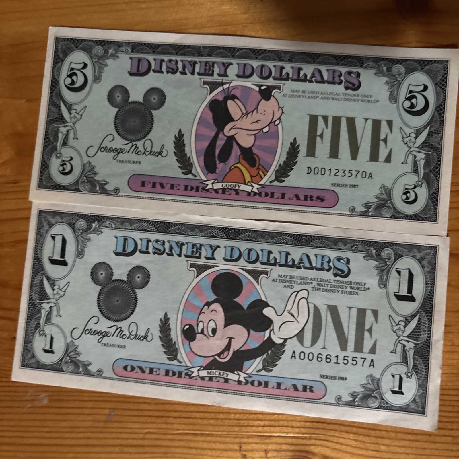 Two vintage Disney Dollars, Series 1987 Goofy Five Dollar and 1989 Mickey $1