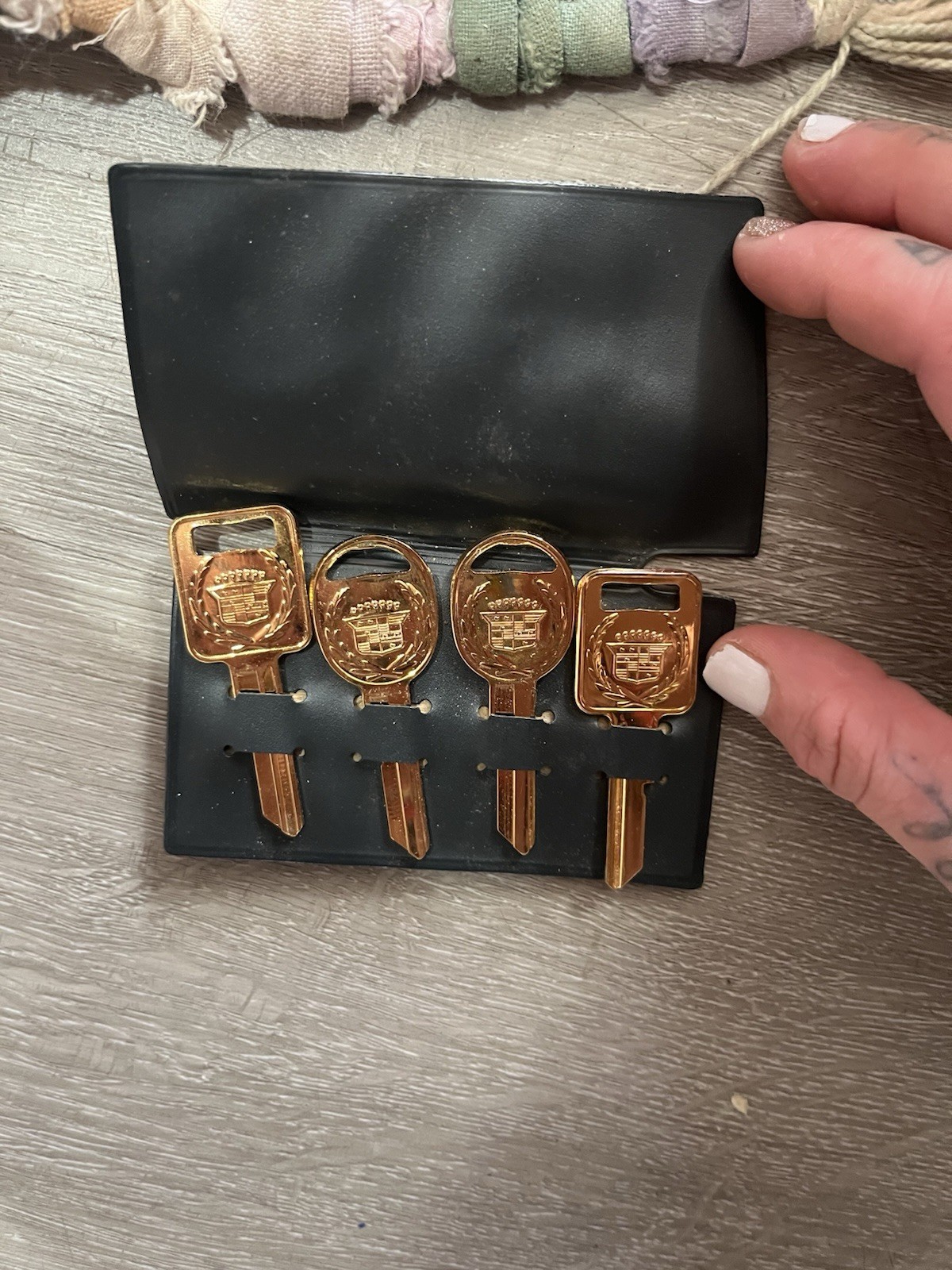 vintage 24k gold-plated GM/Cadillac key blanks stored in a black case