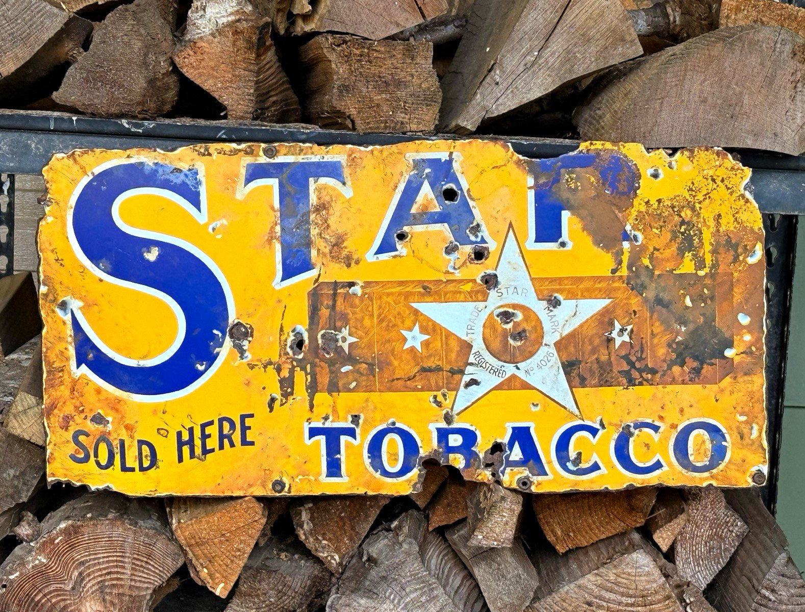 This is an absolutely unique, antique 1920s-1930s Star Tobacco advertising sign
