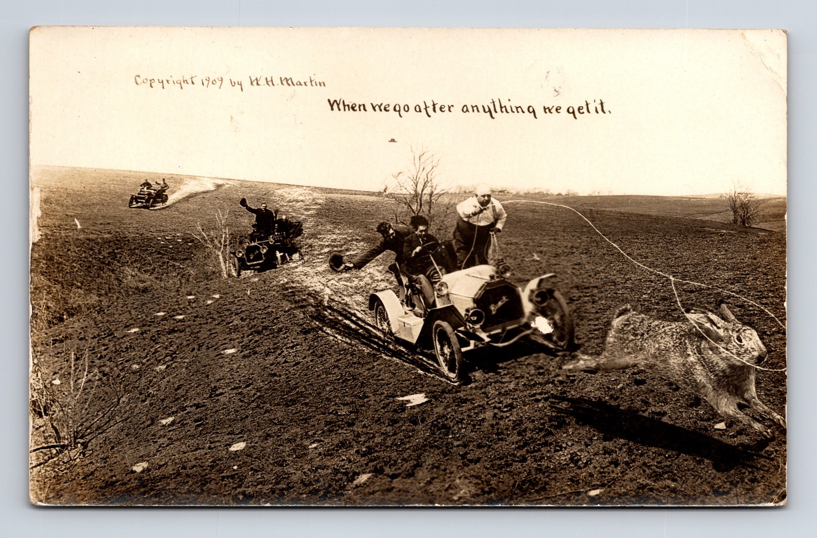 1912 W H MARTIN RPPC Exaggerated Giant Jack Rabbit Lasso by Men in Cars Postcard