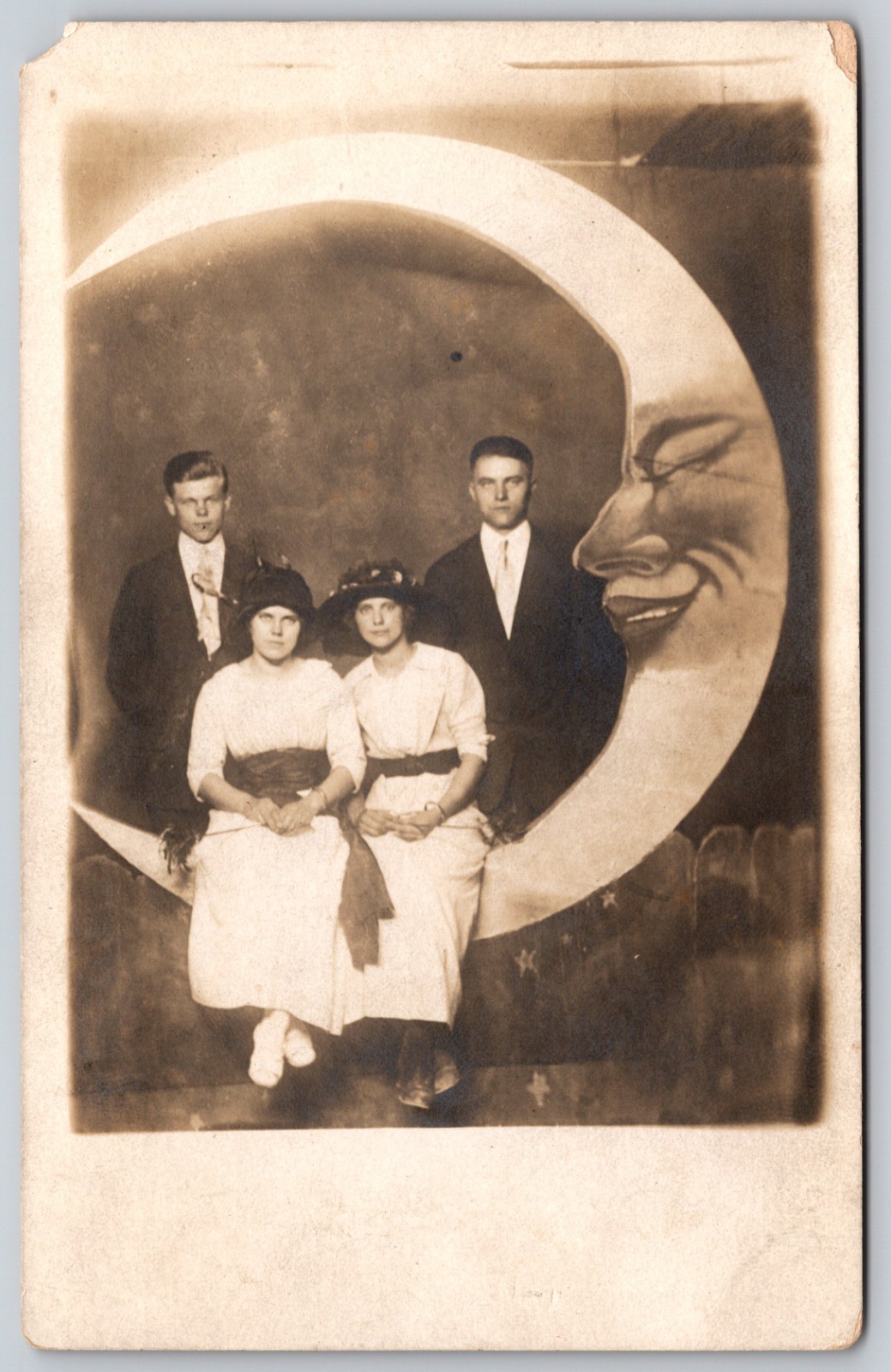 RPPC Postcard Two Unhappy Couples Seated On Left Facing TALL Paper Moon