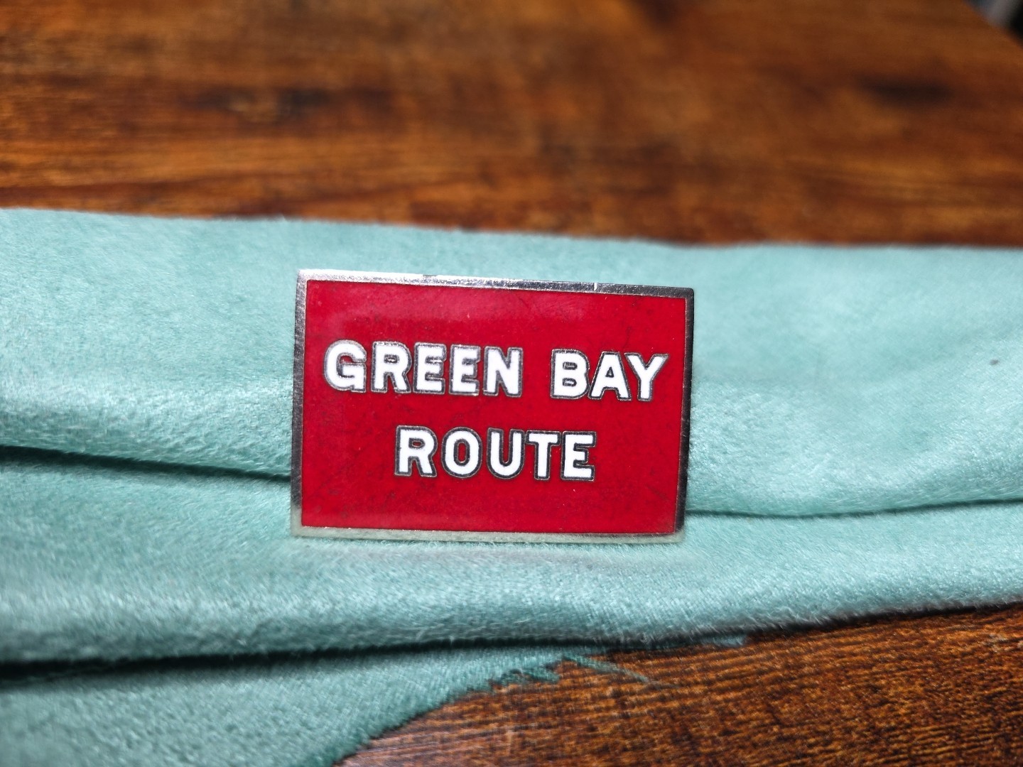 Railroad Hat-Lapel Pin/Tac- Green Bay Route. Metal With Red And Silver Trim.