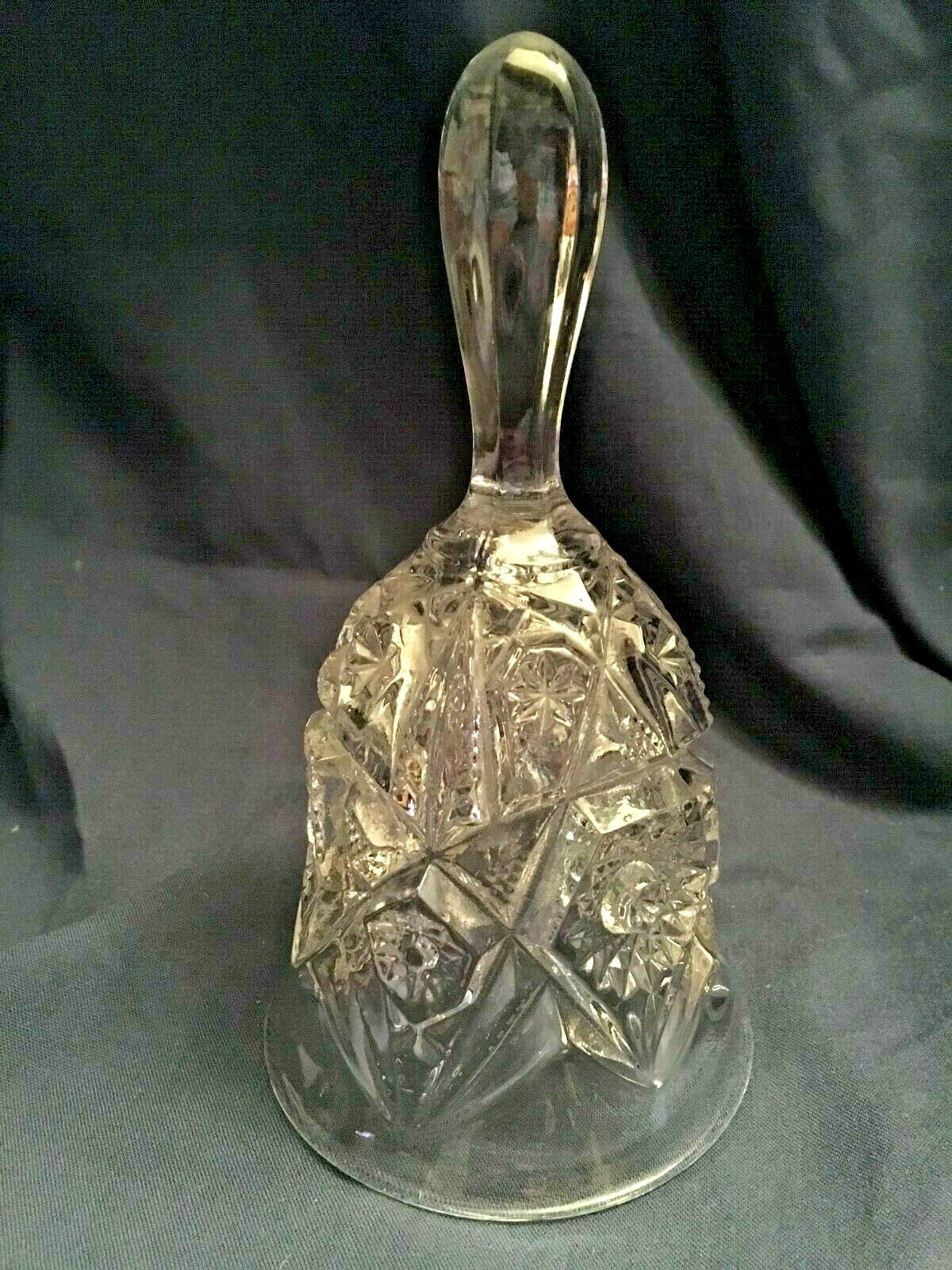 pressed glass bell. Clear. Clapper is clear. 7 inches pressed glass bell. Clear. Clapper is clear. 7 inches