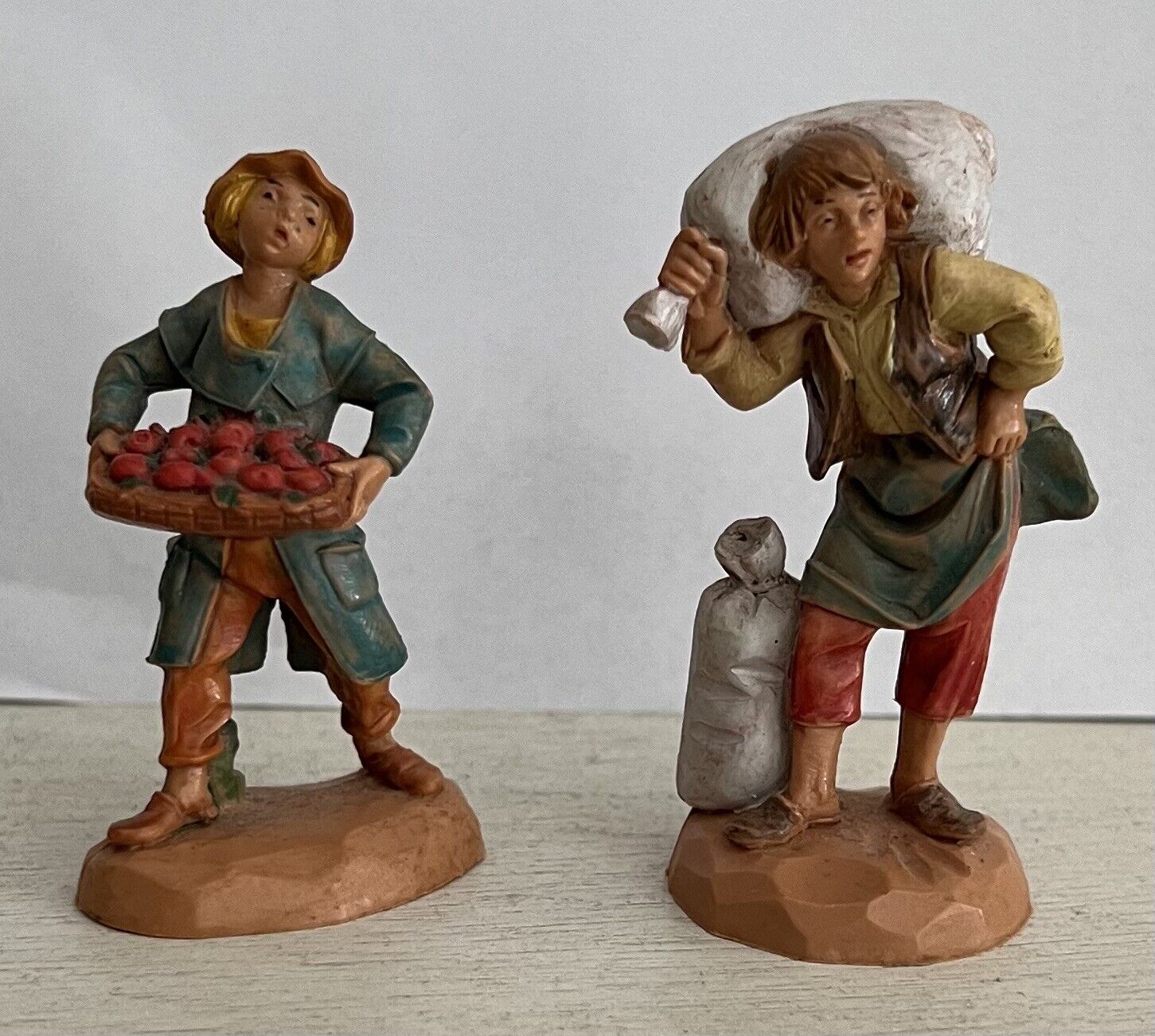 Two Fontanini ITALY 2.5 Peasant Boys  One Carrying Apples 1990 One Carrying Sack