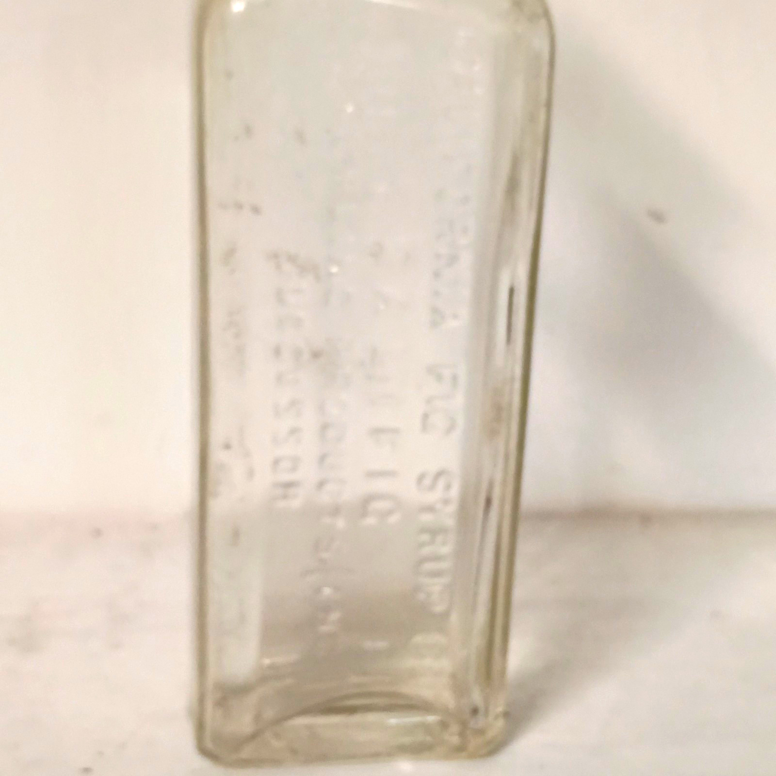 Vintage Clear Glass Embossed Medicine Bottle \