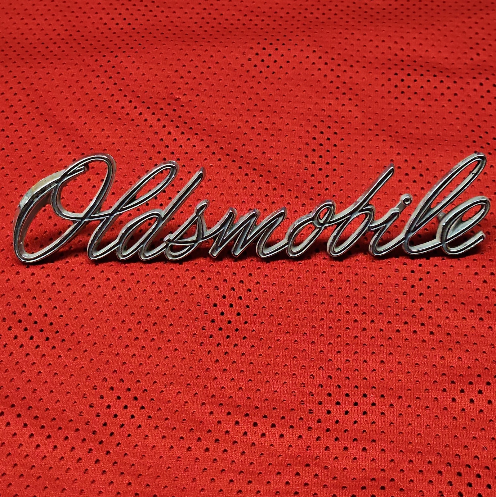 Vintage OEM Oldsmobile 1970 Script Emblem 399094