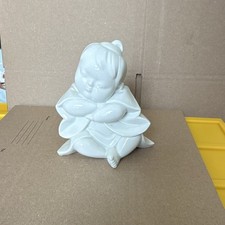 Vintage Figurine Baby Resting picture