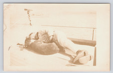 c1912 Sailor Napping with CUTE 🐾 Black Bear Cub on Ship Deck RPPC Mascot picture