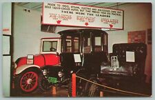 Lincoln Nebraska~Autos By The Dozen In Line Transportation~Vintage Postcard picture