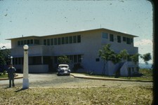 c1950's 35mm Slide Unknown Film, Man Car Modernist Building Tropical Climate picture