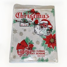 Vtg Royal Crest NEW Christmas Tablecloth Santa Floral Bells 52” X 70” Wipe Clean picture