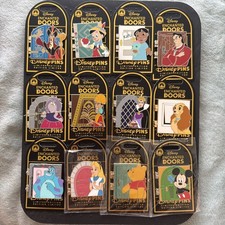 Currently **COMPLETE SET ** 12 LE Disney Enchanted Hinged Doors Pins 2026 picture