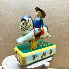 VINTAGE 1950'S GALLOPING COWBOY SAVINGS BANK BATTERY OPERATED TIN TOY JAPAN RARE picture